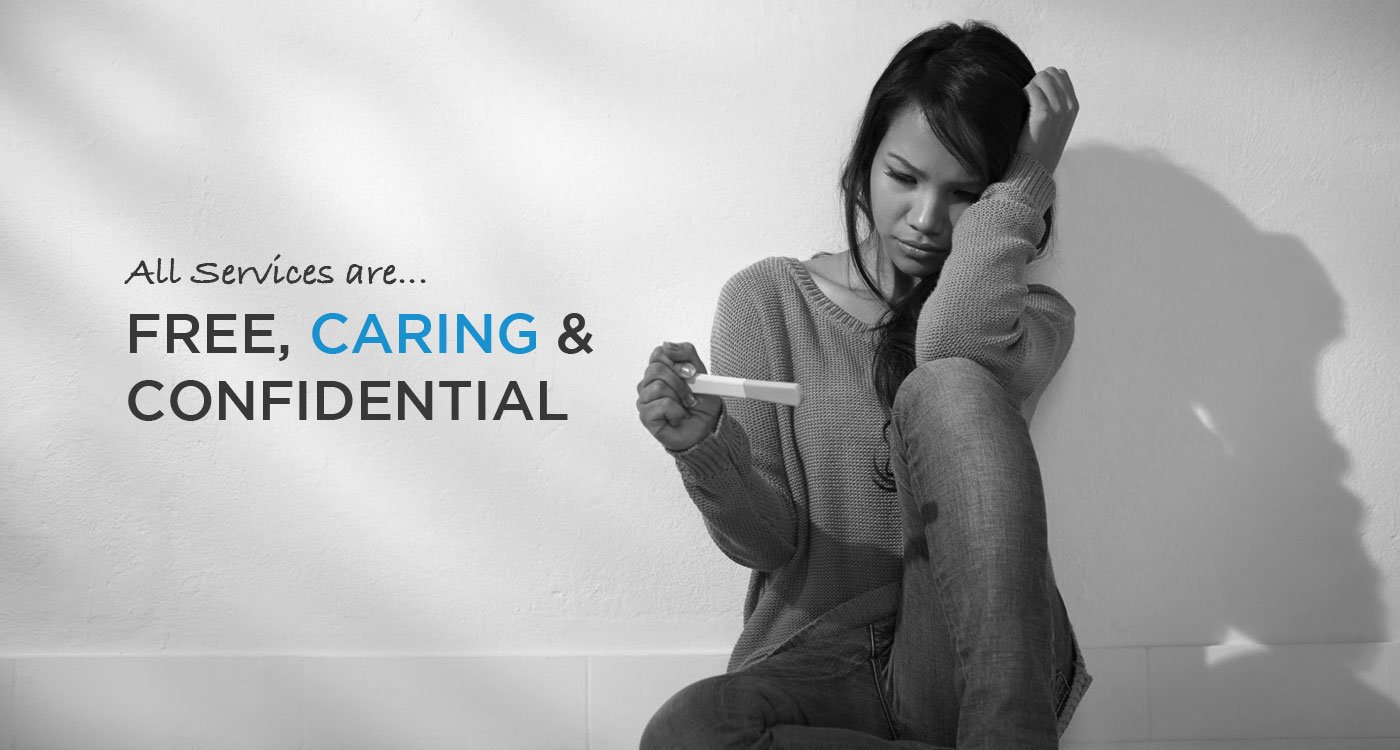 Young woman holding a pregnancy test